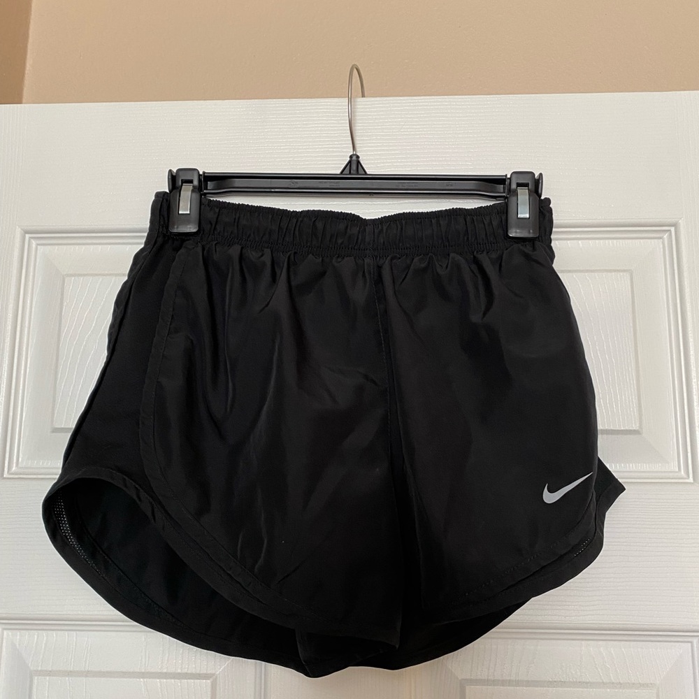Nike dry fit. Size small. Great condition! They do have built in shorts.